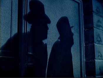 『肉の蝋人形』 1933、約14分：二人の男の影
